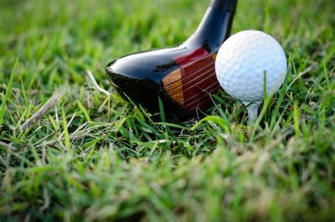 Premium Photo Close Up Of Golf Club And Ball On Course