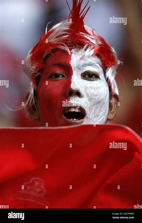 An Indonesian Supporter Cheers Before The Final First Leg Soccer Match