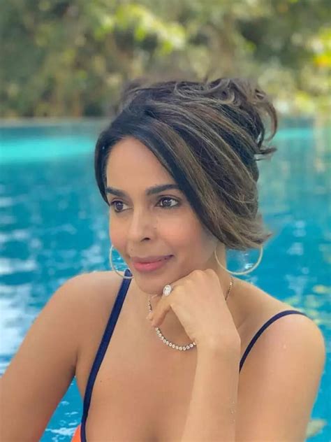 Mallika Sherawat Goes Besharam Rang In Orange Bikini Jumps Into Pool Times Now