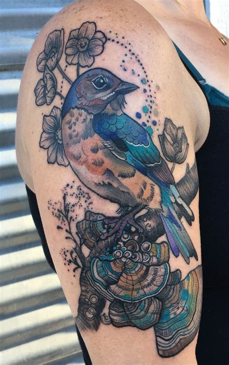 A Woman S Arm With A Bird And Flowers On It