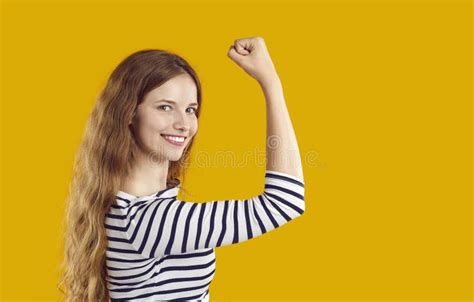 Happy Confident Strong Young Woman Showing Girl Power Flexing Her Arm