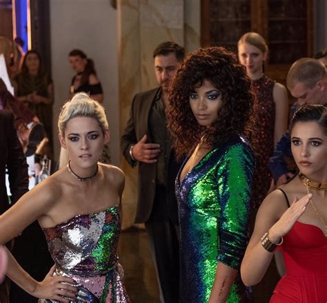 Three Women In Sequin Dresses Standing Next To Each Other