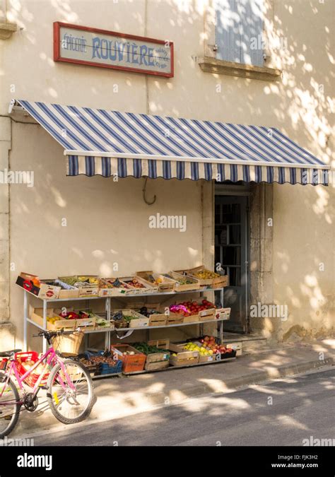 Exterior Of Typical Small Grocery Store With Fresh Local Produce For