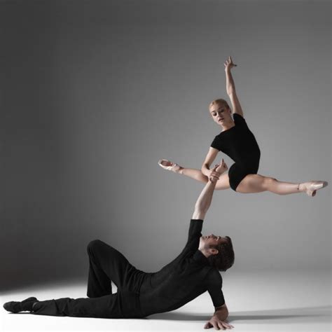 Two Young Modern Ballet Dancers On Gray Studio Background Stock Photo