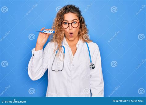 Young Beautiful Blonde Doctor Woman With Blue Eyes Wearing Stethoscope