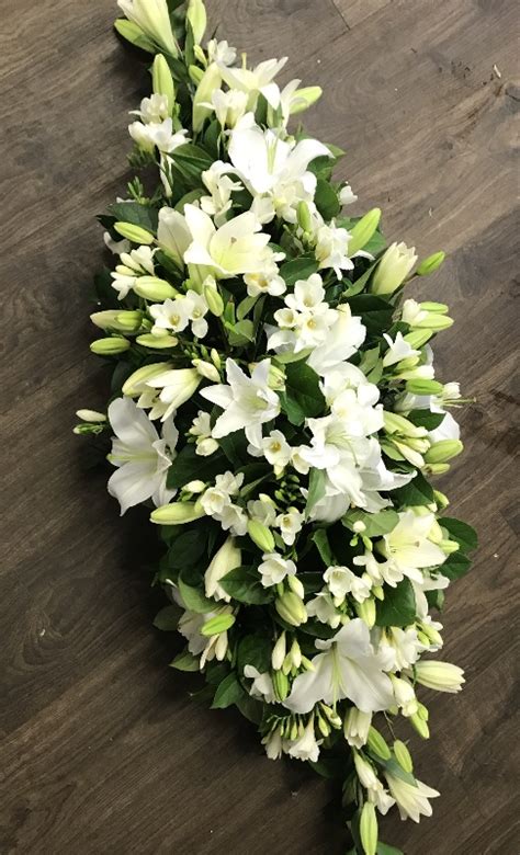 Lily And White Freesia Casket Spray Buy Online Or Call