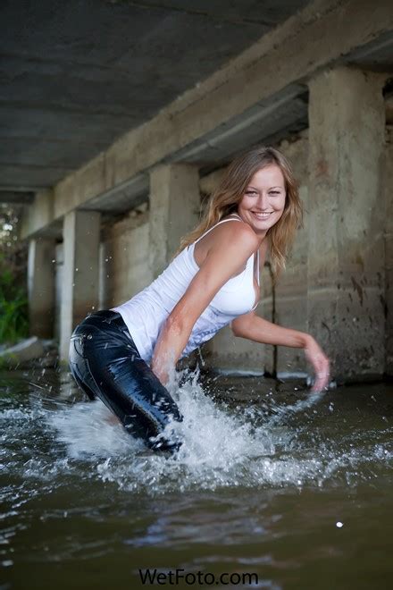 Hot Blonde Girl In Tight Jeans T Shirt And Shoes Get Soaking Wet In Lake