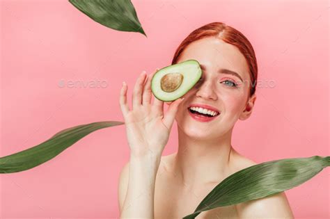 Front View Of Happy Naked Woman With Avocado Smiling Ginger Girl