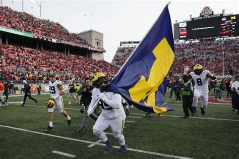 Michigan Football Players Plant Flag On Ohio State Field After Rivalry