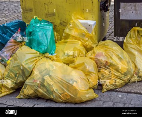 Yellow bags full of plastic waste Stock Photo - Alamy