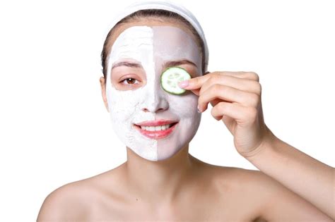 Premium Photo The Girl Applying Face The Clay Mask A Woman Puts A