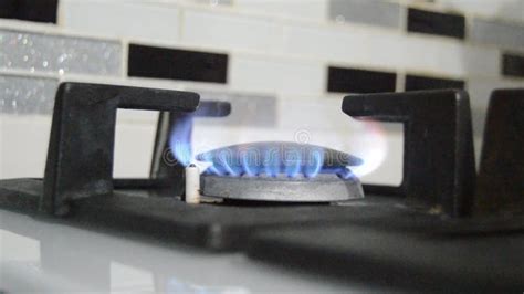 Gas Stove Burning In The Kitchen Blue Flames Black Background Stock