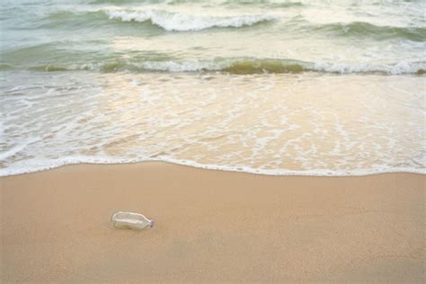 Premium Photo Empty Glass Bottle Was Dumped On The Beach Causing