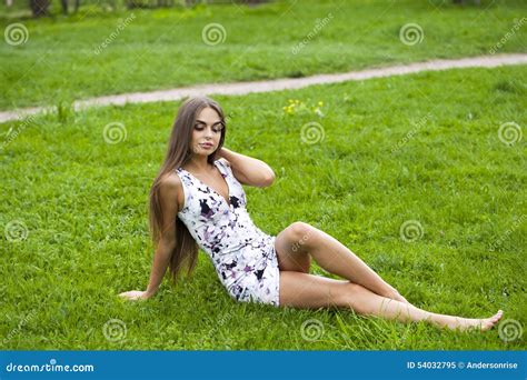 Woman In Short Dress Sitting On Green Grass Stock Image Image Of