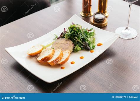 Canape With Foie Gras Pate And Salad Served With White Wine Stock Image