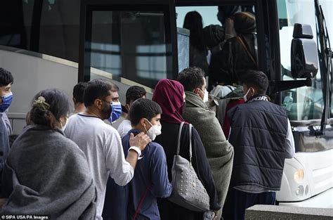 Afghan Evacuees Arrive At Dulles On One Of Last Flights Out Before