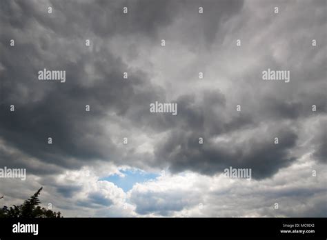 overcast sky  dark clouds clouds  heavy raining stock photo