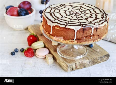 Halloween Chocolate Spider Web Cake And Various Fruits Around Party