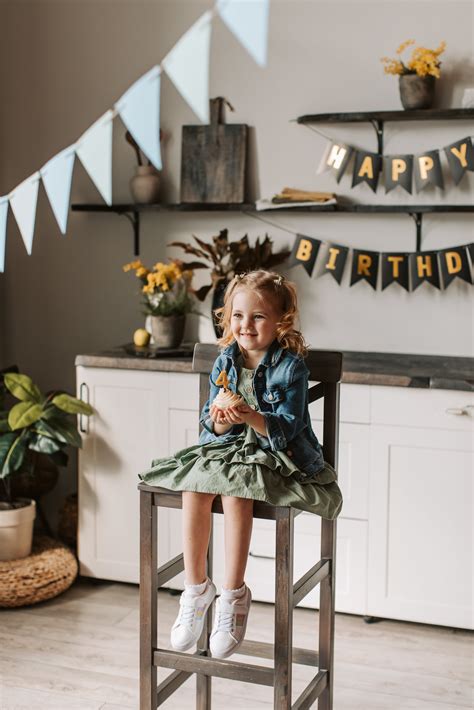 Photograph of a Kid Sitting on the Floor while Holding Cards · Free Stock Photo