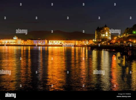 The Grand Hotel by Llandudno Pier with the waterfront holtels on the ...