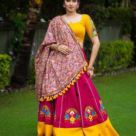 Yellow Cutwork Lehenga With Green Choli And Pink Bandhni Dupatta