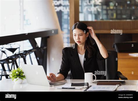 Company Employees Show Boredom From Unfinished Work Using Computer