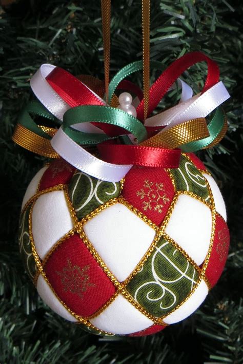 An Ornament Hanging From A Christmas Tree Decorated With Red White And