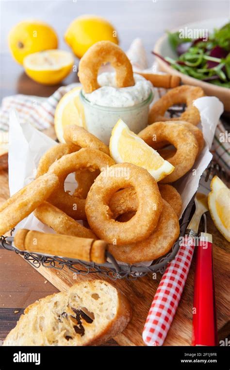 Crispy breaded calamari rings Stock Photo - Alamy