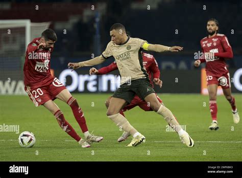 Kylian Mbappe Of PSG Left Pierre Lees Melou Of Brest During The French