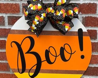 boo door sign etsy