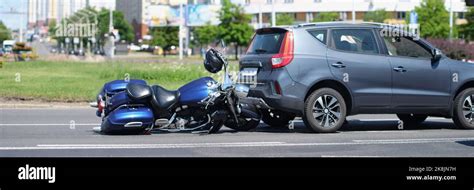 Traffic Accident Between Electric Bicycle And Car Motorbike Fell On