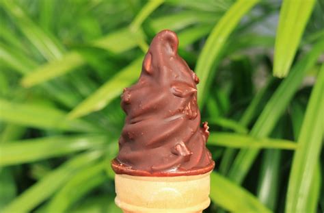 Premium Photo | Chocolate dipped soft serve ice cearm cone