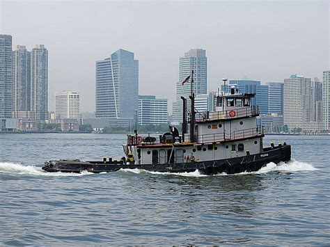 Tugboat On The Hudson River Viewed From Battery Park City Lower