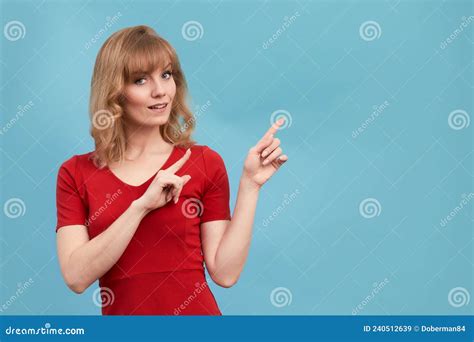 Happy Surprised Blonde Young Female Smiling Broadly At Camera Pointing