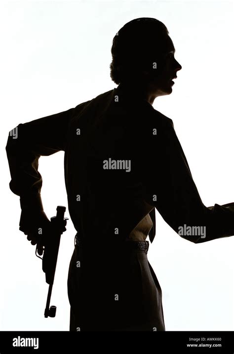 Man holding gun, silhouette Stock Photo - Alamy