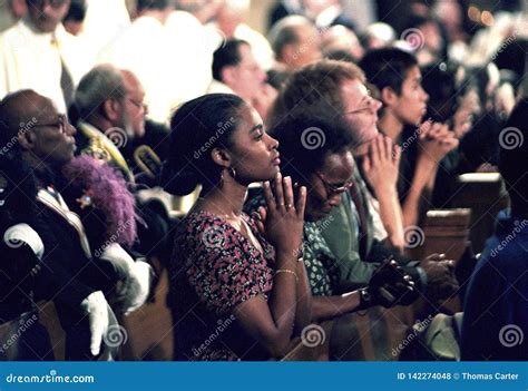 Several People Praying in a Church Service IPeople Editorial Stock ...