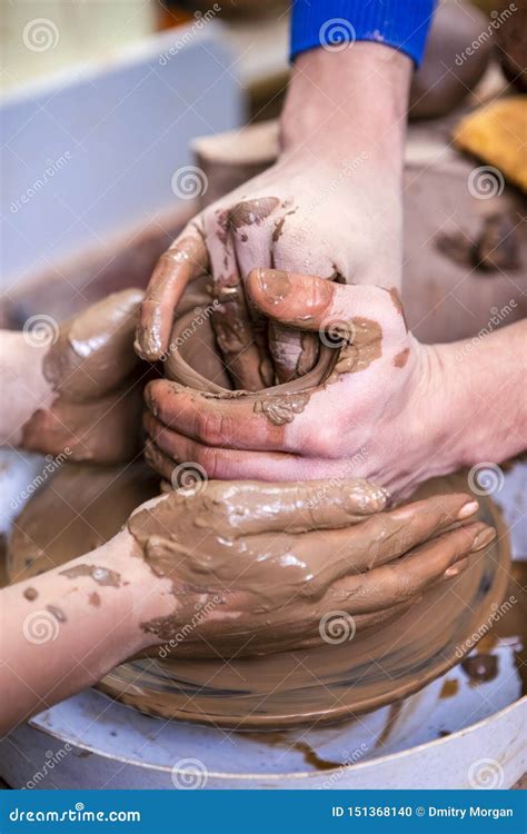 Old Hand Experienced Male Potter Working With Female Apprentice