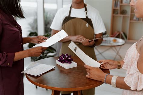 Close-up Shot of People Exchanging Gifts and Cards · Free Stock Photo