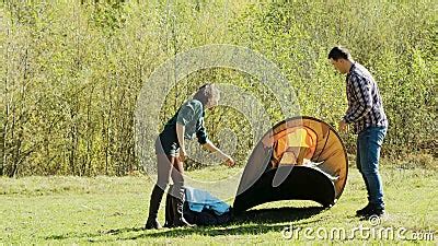 Attractive Young Man and His Girlfriend Setting Up Tent for Camping Stock Video - Video of ...