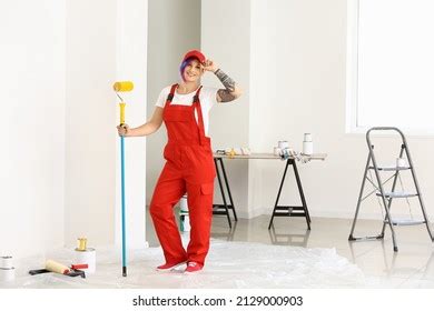 Female Painter Red Uniform Paint Roller Stock Photo 2129000903