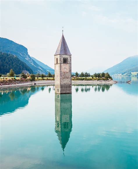 The Old Bell Tower Of Curon Venosta Church Rising Out Of The Waters