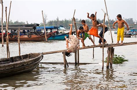 Children Playing In The Mekong River Vietnam Stock Photos Pictures