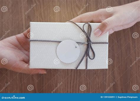 Hands Giving And Receiving A Present Stock Image Image Of Concept