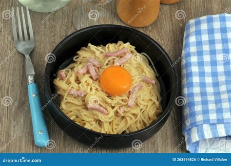 Spaghetti Carbonara With An Egg Yolk Served In A Plate Top View Stock