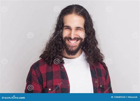 Funny Handsome Man With Beard And Black Long Curly Hair In Casual Style Checkered Red Shirt