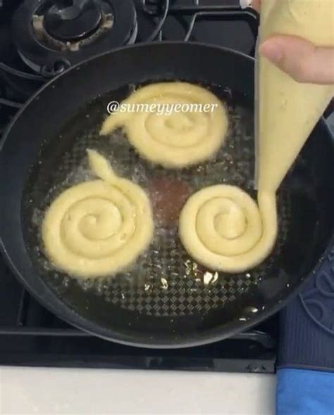 Someone Is Frying Some Food In A Skillet On The Stove And It Looks Like