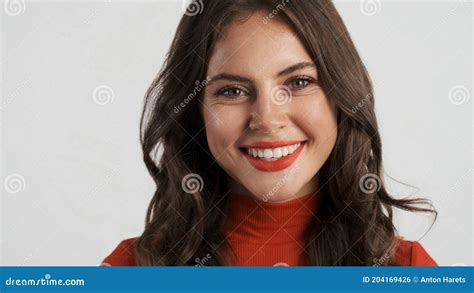 Portrait Of Beautiful Smiling Girl Happily Looking In Camera Over White