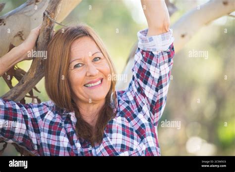 Portrait Attractive Mature Woman In Rural Country Wearing Plaid Shirt