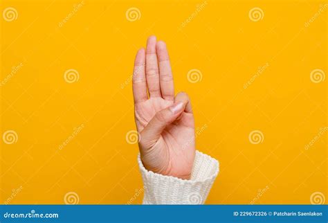 Thumbs Up Showing Goodness Justice Virtue On A Yellow Background Stock