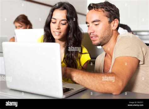 Two students talking in the classroom Stock Photo - Alamy